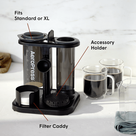 Aeropress coffee maker with labeled parts on a white background