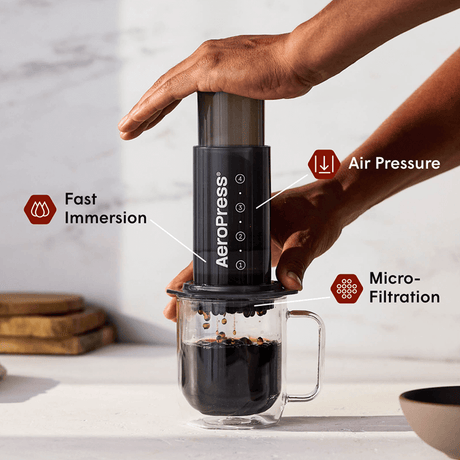 AeroPress Original coffee maker with a glass of brewed coffee