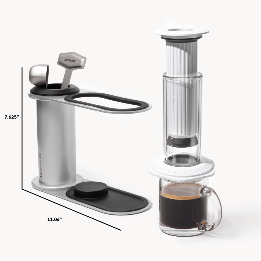 Coffee maker with dimensions and a glass of coffee on a white background #color_white