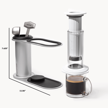 Coffee maker with dimensions and a glass of coffee on a white background #color_white