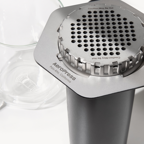 AeroPress coffee maker on a white background #color_black