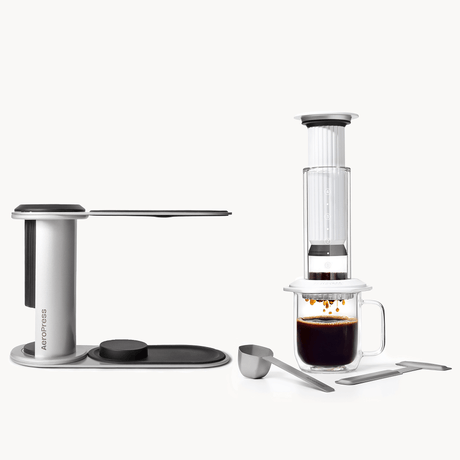 AeroPress Premium coffee maker with a glass of coffee on a white background

#color_white

