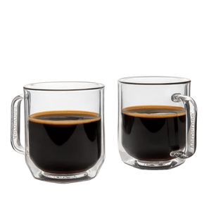Two clear glass mugs filled with black coffee on a white background