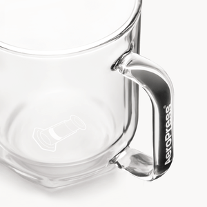 Clear glass AeroPress Mug with handle on a white background