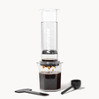 AeroPress Clear XL coffee maker with a white background
