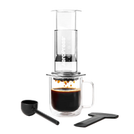 Coffee brewing device with a glass mug and scoop on a white background #color_clear