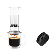 Aeropress coffee maker with a cup of coffee and a black filter on a white background Clear Pink #color_clear