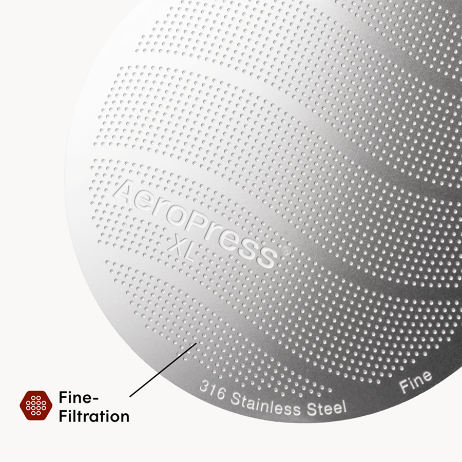 Close-up of a metallic AeroPress XL coffee maker with '316 Stainless Steel' text on a white background.