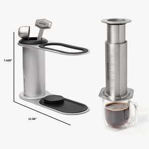 Aeropress coffee maker with dimensions and a cup of coffee on a white background #color_silver
