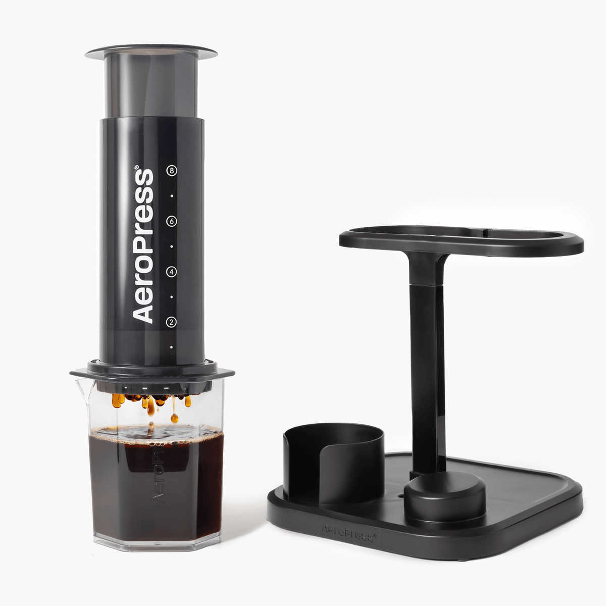 Aeropress coffee maker with a stand on a white background